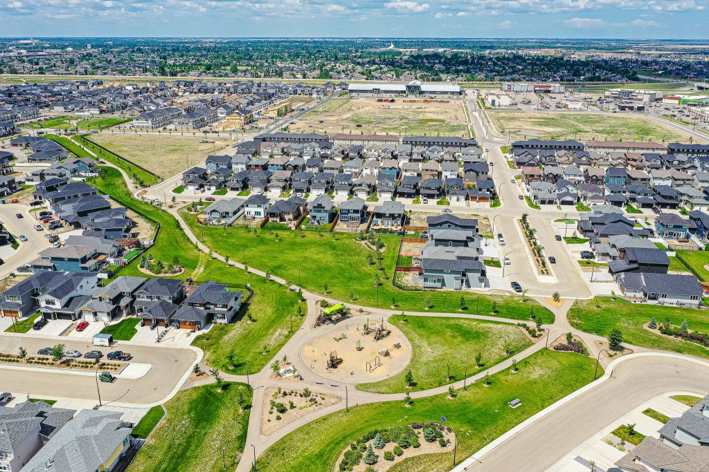Stunning aerial showcase of Brighton in Saskatoon, encapsulating its modern suburban elegance and the pristine landscapes of Saskatchewan